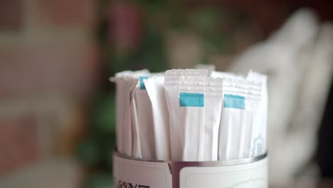 sugar packets in a holder