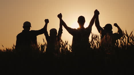 A Group Of Successful Young People Hold Hands Together They Raise Their Upper Hand Successful Team A