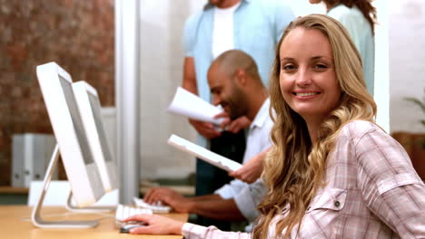 Casual-businesswoman-smiling-at-camera