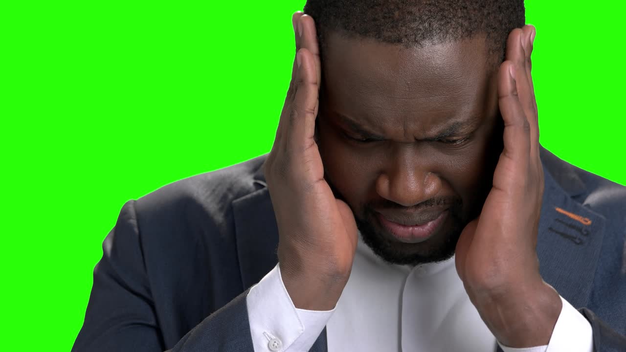 Tired and depressed businessman with headache.