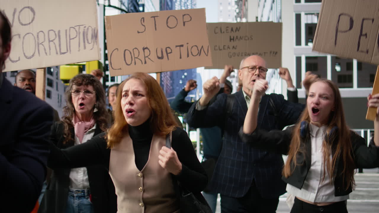 Activists marching together in political protest against corruption and misconduct