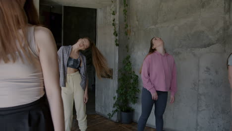 group of women practicing contemporary dance in a studio