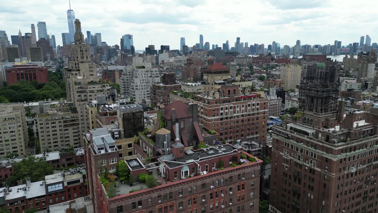 Drone panning shot of E 12th Street, New York in horizontal orientation. Captures the dynamic cityscape and street activity, ideal for real estate, travel, and urban landscape projects.