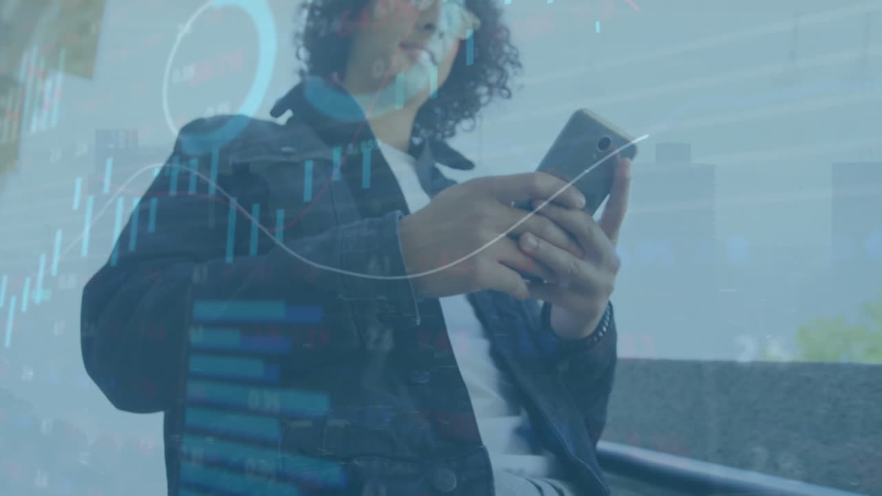 Animation of data processing and diagrams over biracial casual businessman using smartphone