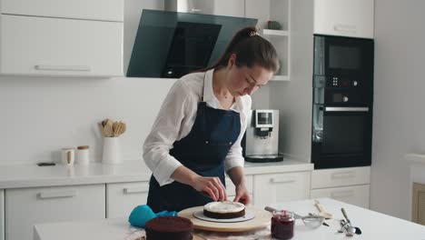 woman making chocolate cake in kitchen, close-up. cake making process, selective focus