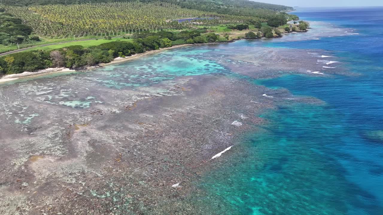 Aerial View of Tropical Island Coastline with Coral Reef