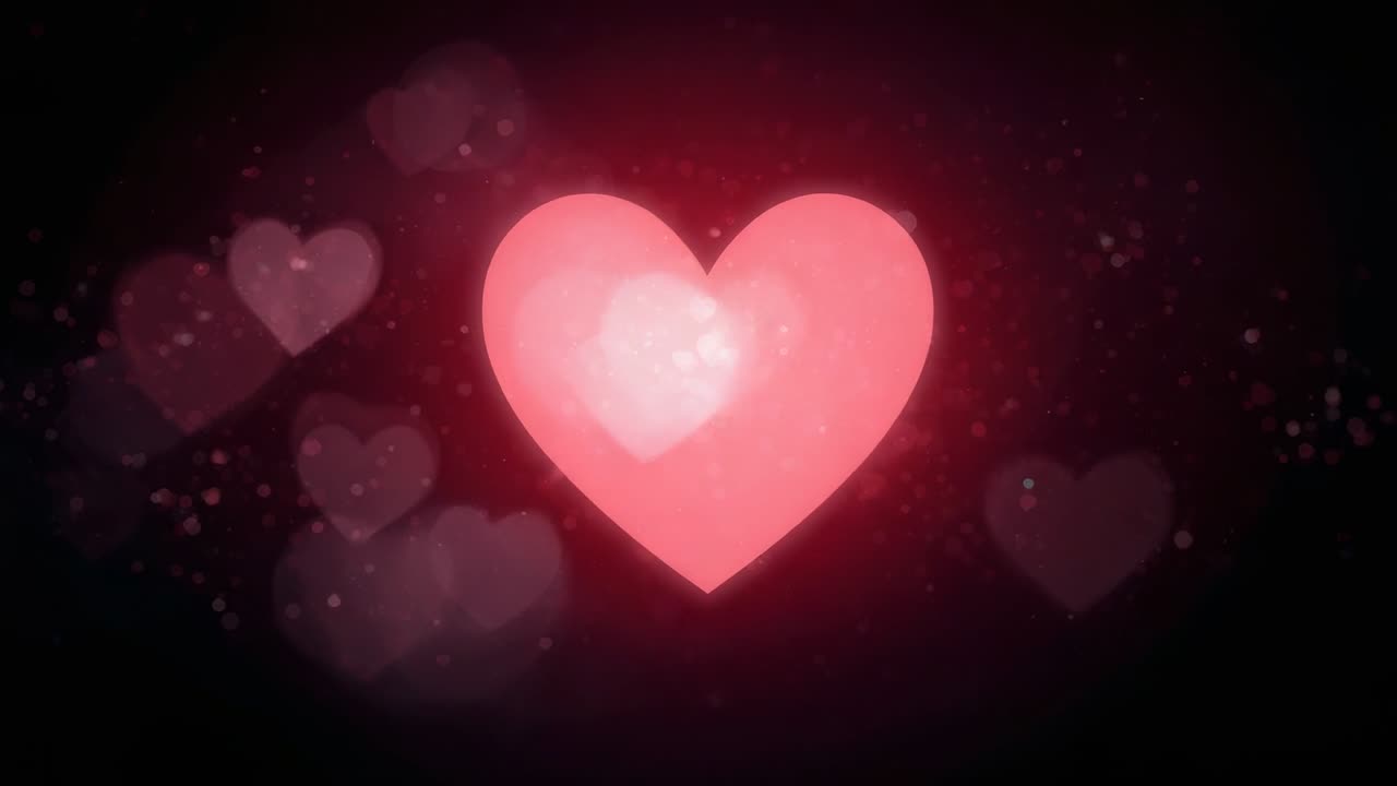 Cuore rosa acceso al centro che pulsa ed emette una luce su uno sfondo scuro, con cuori e granelli fluttuanti