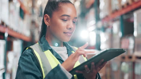 woman using tablet in warehouse
