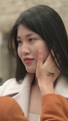 woman with rainbow tattoo