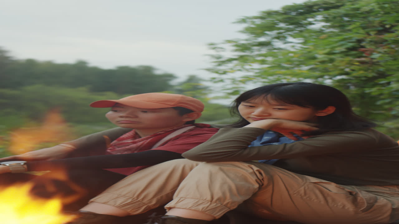 Lesbian Couple Resting by Campfire