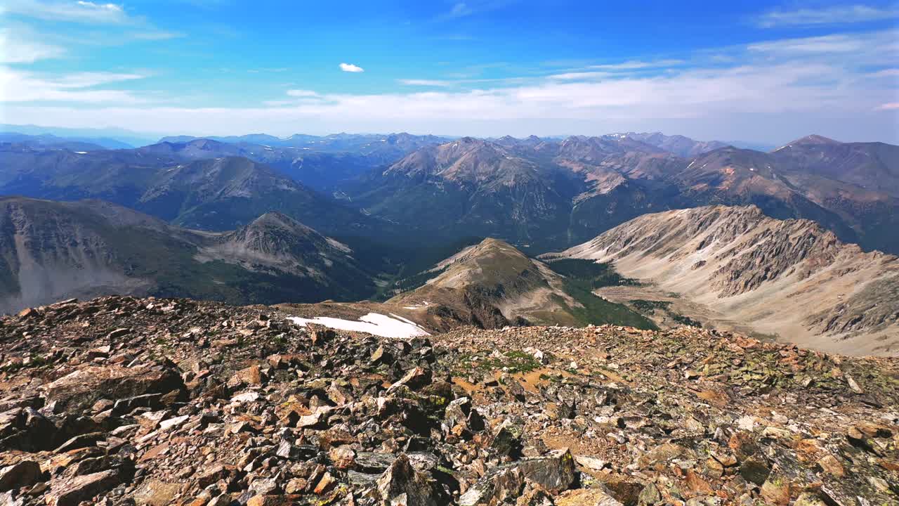 La Plata Peak Gulch Trail 14er view of Independence Pass Sawatch Range 14er spring summer Rocky Mountains Colorado high alpine elevation above treeline snow fields morning blue sky haze pan left