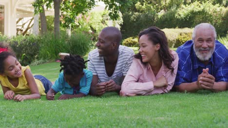 multi-generation african american family spending time in garden together