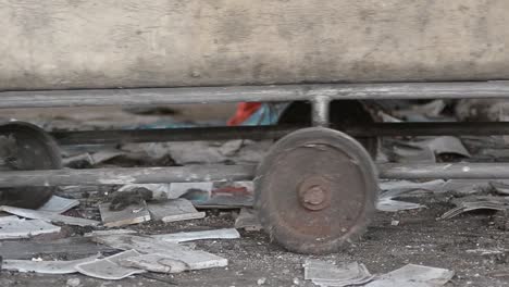 Pushing-an-old-cart-in-abandoned-derelict-mill