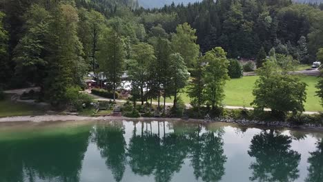 drone view of the shoreline of the langbathsee in austria