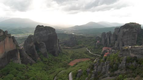 Aerial-Flyover-Revealing-The-Ancient-Holy-City-Of-Meteora-In-Greece,-A-Geological-Wonder-And-Top-Travel-Attraction