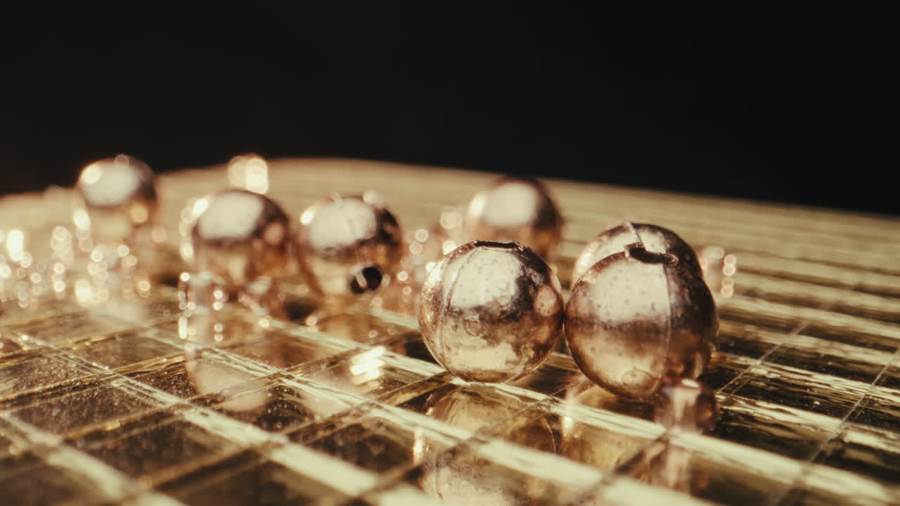 Golden Copper Beads on Glass Surface