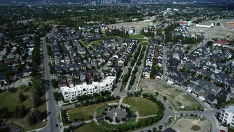 revealing aerial shot of the downtown with beautiful clouds in summertime