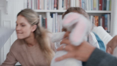 happy-family-having-pillow-fight-mother-and-father-enjoying-playing-with-children-at-home-having-fun-together-on-weekend-4k-footage