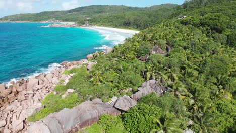 aerial view of the white beaches and turquoise waters at anse coco, petit anse and grand anse on la digue, an island of the seychelles