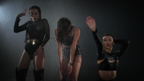 wet dance performance by three women