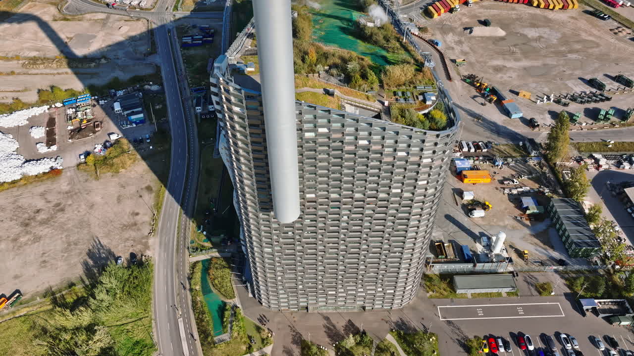 Aerial drone view of CopenHill artificial ski slope on the roof of an energy plant