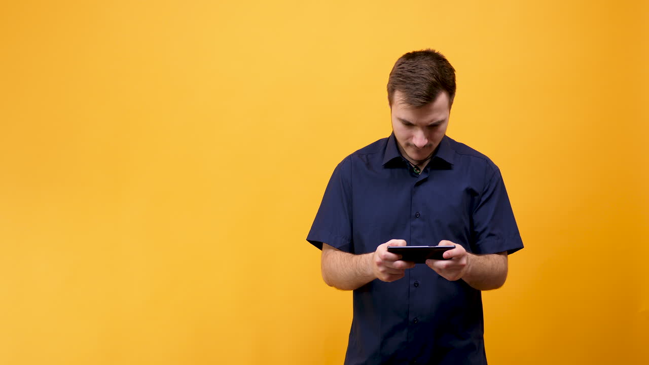 Man playing video game on mobile phone