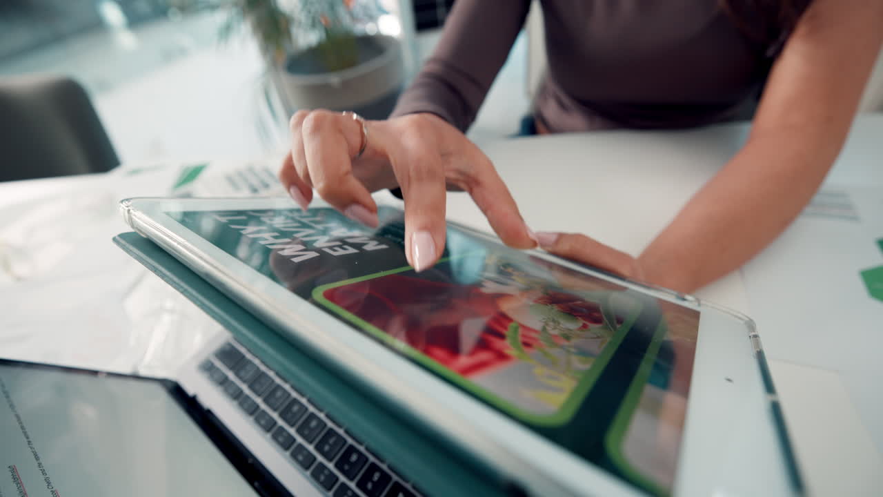 Close-Up of Woman's Hands Using Digital Tablet in Office