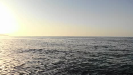 Man-standing-at-the-ocean-shore