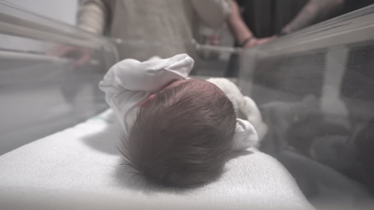 Infant birth healthcare, nursery crib, motherhood, fatherhood