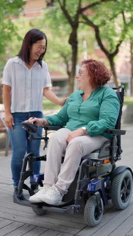 woman in wheelchair with caregiver