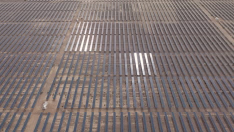 solar panels in a desert solar farm, aerial panorama