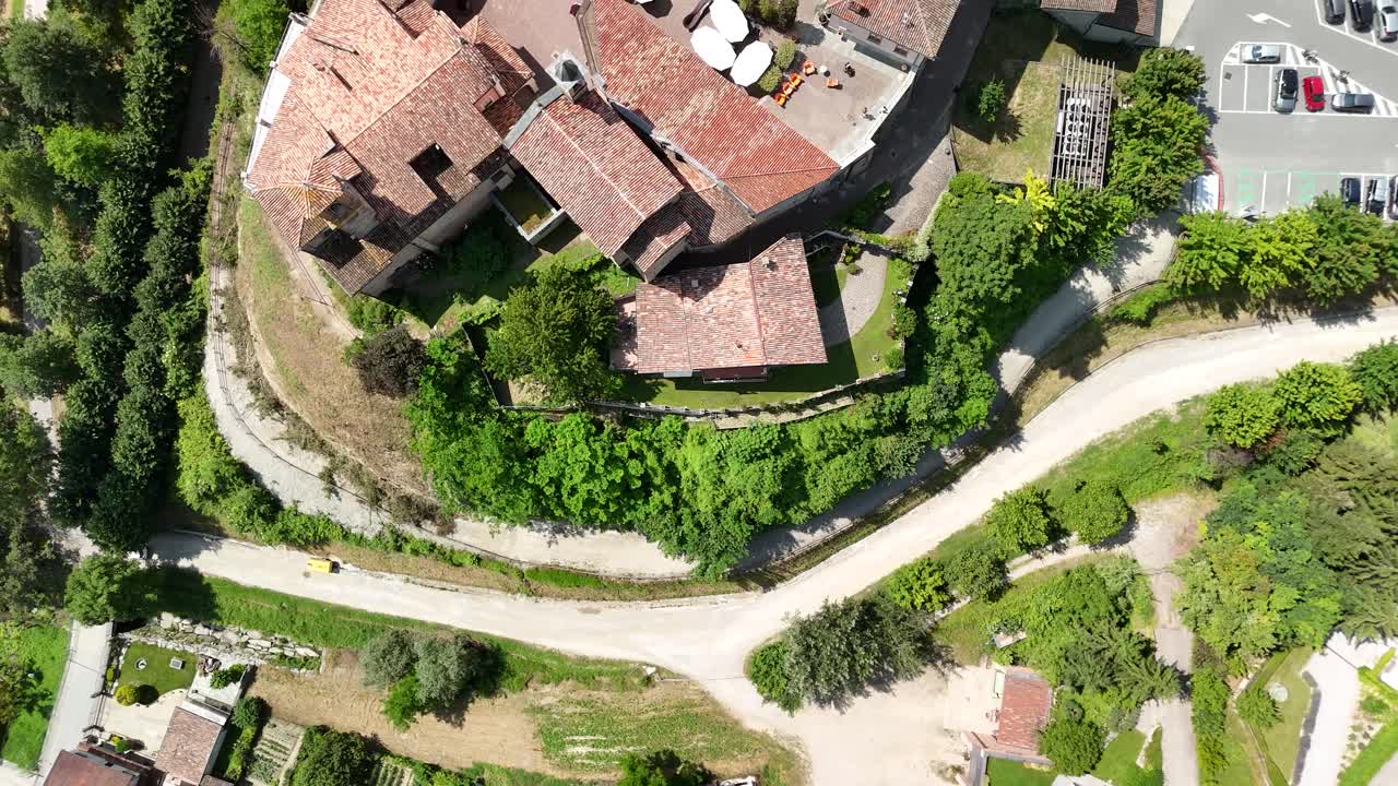 Barolo Castle in Langhe Wine Region, Cuneo, Piedmont, Italy. 4k Aerial view top down zenital, flying above the castle.