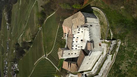 vertical of medieval complex building of belasi castle near campodenno in trentino, italy