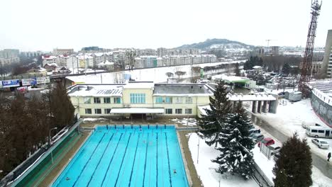 swimmers practice in swimming pool winter. aerial shot