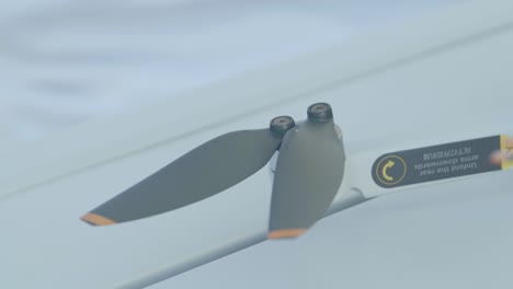 detail of a drone propeller being mounted, slow motion, close up