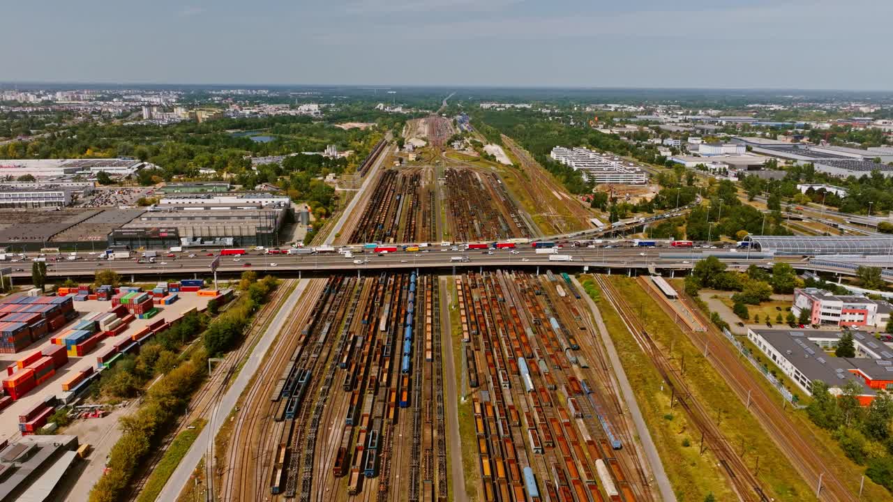 Highway congestion in Warsaw shows busy traffic over motionless train depot