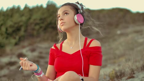 teenager girl on the beach writing on diary. shot in slow motion