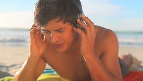 man listening to music with headphones