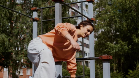 man and woman training parkour