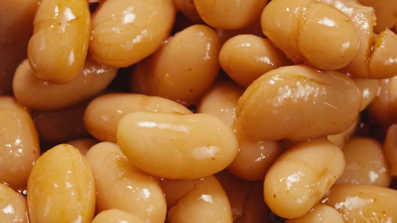 Canned red bans preserved beans rotating background close up side view. Organic steamed beans. Pickled bean for a Mexican dish