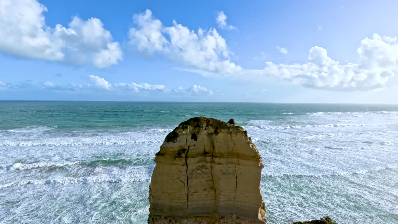 A scenic video capturing the Twelve Apostles rock formations along Australia's Great Ocean Road under bright daylight