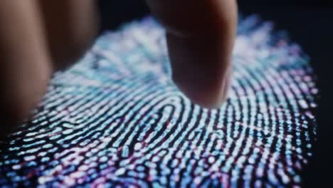 A close-up view shows a finger touching a digital fingerprint sensor that captures unique patterns for identification. This technology plays a key role in security and law enforcement.