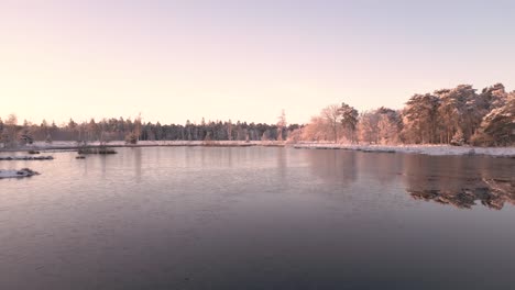 frozen winter sunrise over a lake