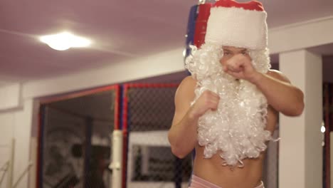santa claus in boxing gloves trains in the ring santa claus in boxing gloves trains in the ring the concept of the new year
