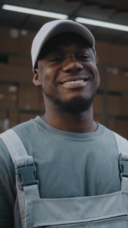 happy african american warehouse worker smiling