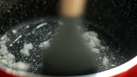 Detail shot, saucepan saut&eacute;ing white onion