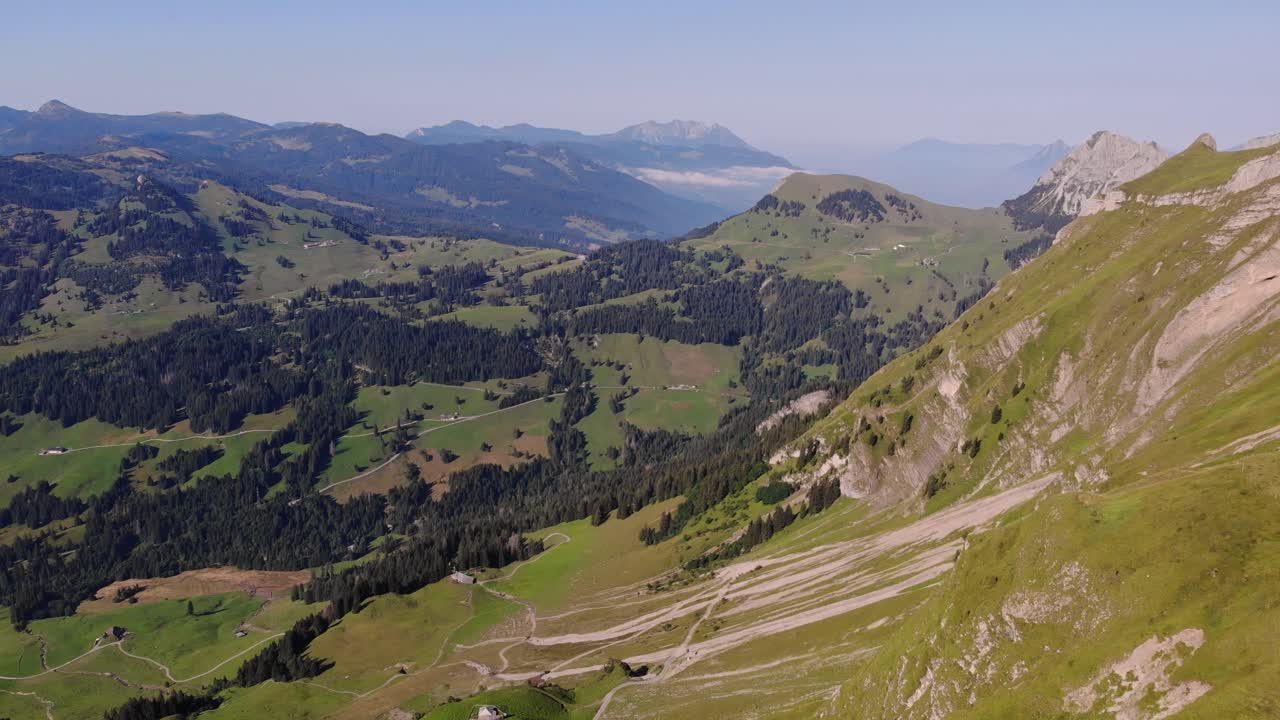 Alps mountain range and hiking trails in valley panorama, Brienzer Rothorn, Switzerland