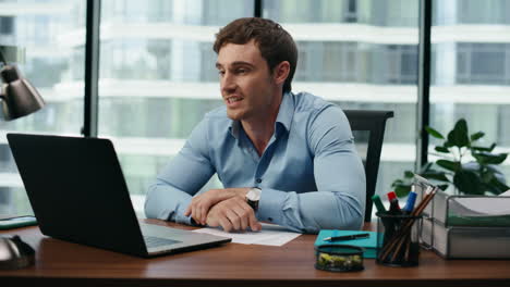 Man-speaking-child-video-call-at-office-break-closeup.-Smiling-guy-using-laptop.