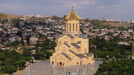 beautiful orbiting drone shot above holy trinity cathedral of tbilisi, georgia