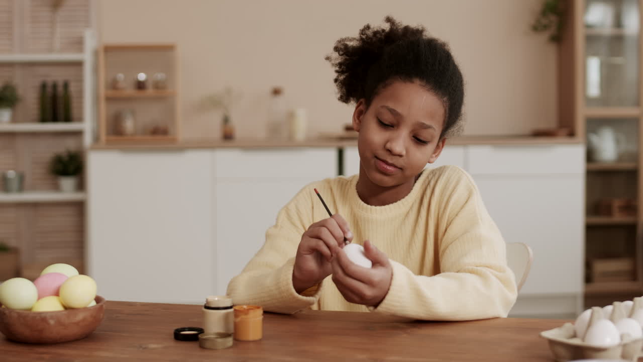 Girl Painting on Egg for Easter